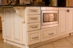 low seated microwave in off white cabinet island | Marchand Creative Kitchens Cabinets, Marchand Creative Kitchens, Cabinets, New Orleans, Metairie, Mandeville, Kenner, Covington, Slidell, Lacombe, North Shore, South Shore, Kitchen, kitchen remodel, kitchen renovation