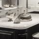 white with dark veins Kitchen Countertop, with white and black cabinets, island with seating | Marchand Creative Kitchens Cabinets New Orleans Metairie Mandeville LA